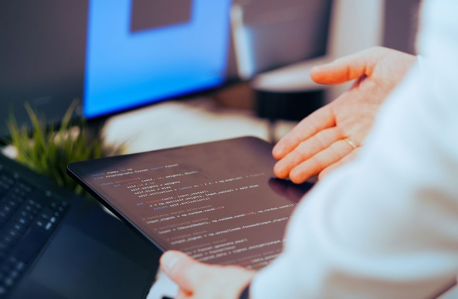 Person using AI tools for content creation on computer workstation