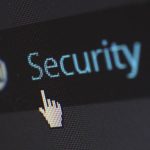 Person typing strong password on laptop keyboard for account security