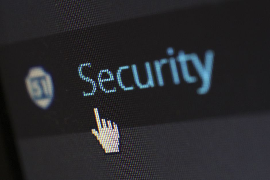 Person typing strong password on laptop keyboard for account security