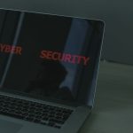 Person using a password manager on laptop for secure account access