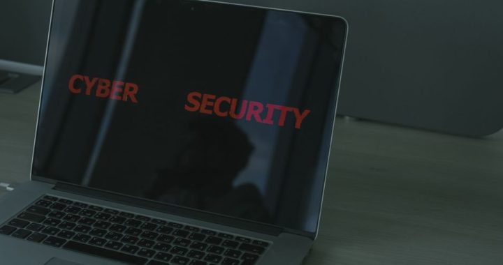 Person using a password manager on laptop for secure account access