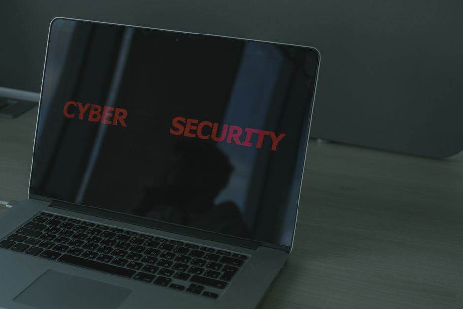 Person using a password manager on laptop for secure account access