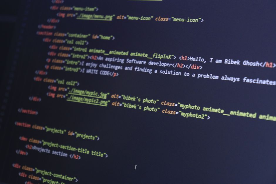 beginner web developer learning to code on laptop
